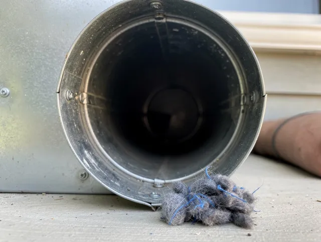 East Hartford Dryer Vent Cleaning technician using specialized equipment to clear severe dryer vent blockage in East Hartford